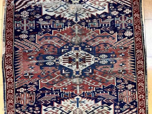 Antique zejwa kuba rug. Heavy wear and scattered damage as shown, priced accordingly. Good colors. Some interesting elements. 19th c. 
3’6” x 6’3”
          