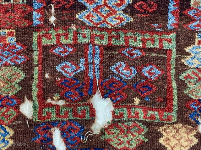 Early east Anatolian Kurdish pile rug fragment. Splendid natural colors with saturation rarely found outside these beautiful weavings. Good fleecy pile with scattered wear, holes, tears and brown oxidation. Edges unraveling. Remnant  ...