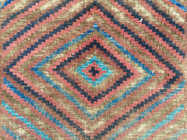 Antique Baluch main carpet. Overall low pile with heavy brown oxidation. All natural colors featuring nice light electric blue highlights. Reasonably clean and intact older example. Nice supple handle and I see  ...