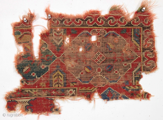 Early fragment of a Turkish rug. ca. 1800 or earlier. 12" x 18"                    