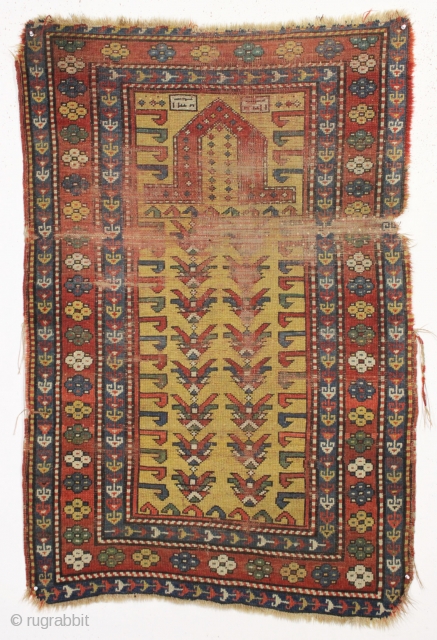 Antique small yellow ground kazak prayer rug. Interesting design. All natural colors.  "As found", very dirty with wear and damage as shown. Priced accordingly. Good age, ca. 3rd qtr. 19th c.  ...