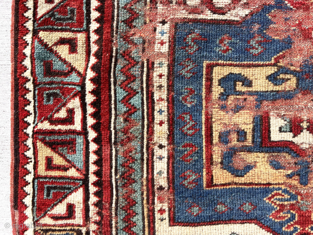 Antique STAR KAZAK. Sorry, no, but truly  an antique Caucasian rug with an iconic Star Kazak border. Cheerful and colorful with wear and scattered old repiling. 3’8” x 6’3”   