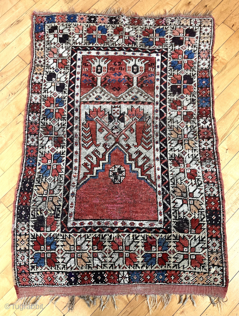Antique Turkish village prayer rug. Attractive design with some unusual elements. Is that a human or animal figure above  the mihrab? Pretty harmonious palette with a very pale green, possibly sulphonic  ...