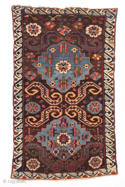 Antique caucasian rug. Eye catching and archaic drawing. Offered earlier in damaged state with numerous holes, now repaired. Not something you find often. 3'4" x 5'5"        ...