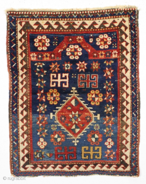 All original diminutive kazak prayer rug.                           