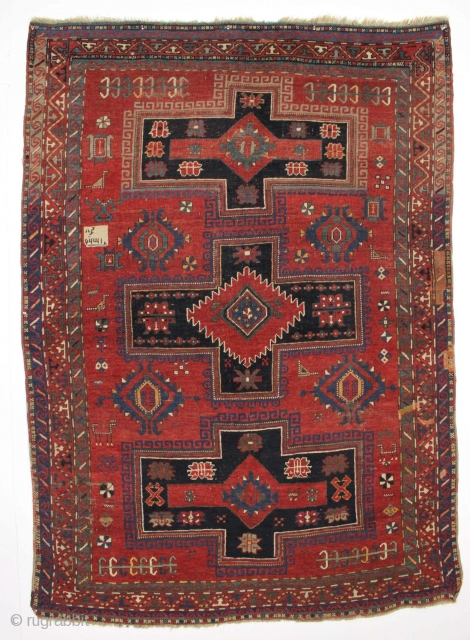 Antique large kazak rug. Great size and colorful. Offered "as found", dirty, a bit of wear and some old crude faded out repairs. Cheerful floor rug. 5'4" x 7'5"    