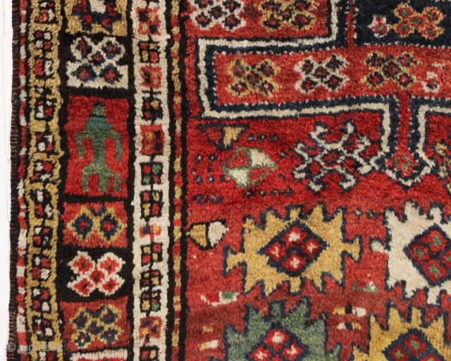 antique large kordi or quchan kurd rug with a strangely assymetric design. In good allover condition with much thick pile. All natural colors featuring a nice old green. A few small repairs,  ...