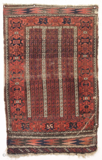 antique baluch rug with an interesting and unusual design. Another piece from a local Boston home. Charming cane design field and an attractive unusual border. All natural colors. In fair condition. Even  ...