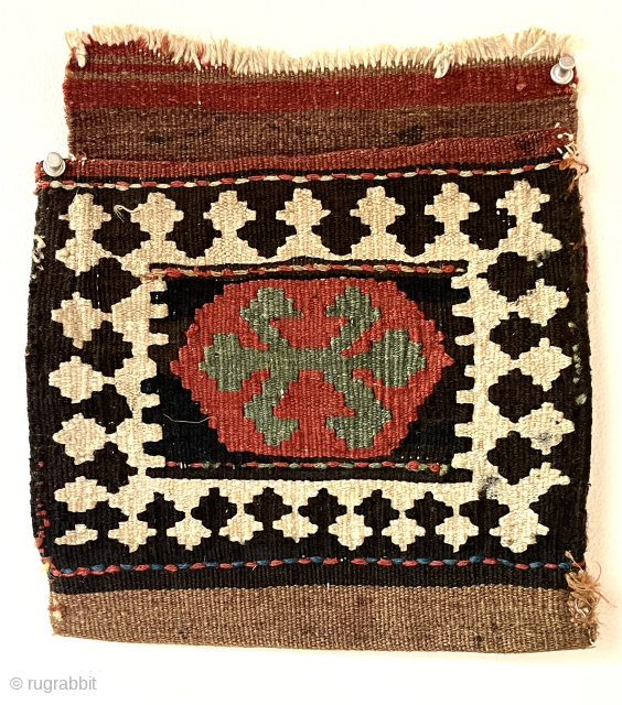 Textile bin clean out. Very small kelim bag with original back. Back attached at one corner. Good color. Good age. About 10” x 10” 
waynecbarron@gmail.com        