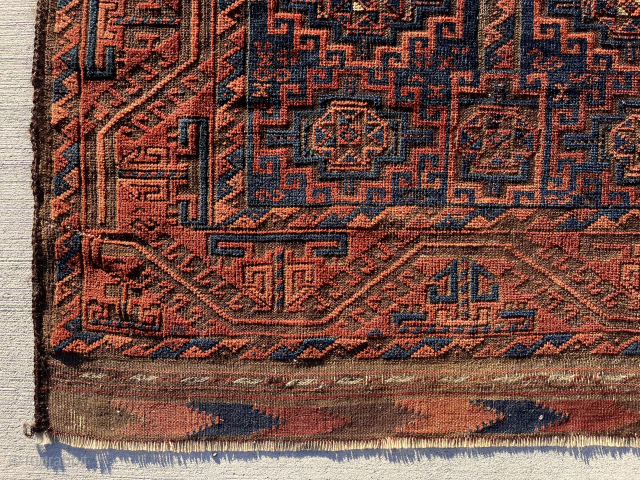 Lovely early fine Baluch rug. Just acquired locally. Attractive blue ground memling gul design. Delicate turkman line border. Decent condition for the age. Persian knotted. Multiple reds. Remnant 2 cord goat hair  ...