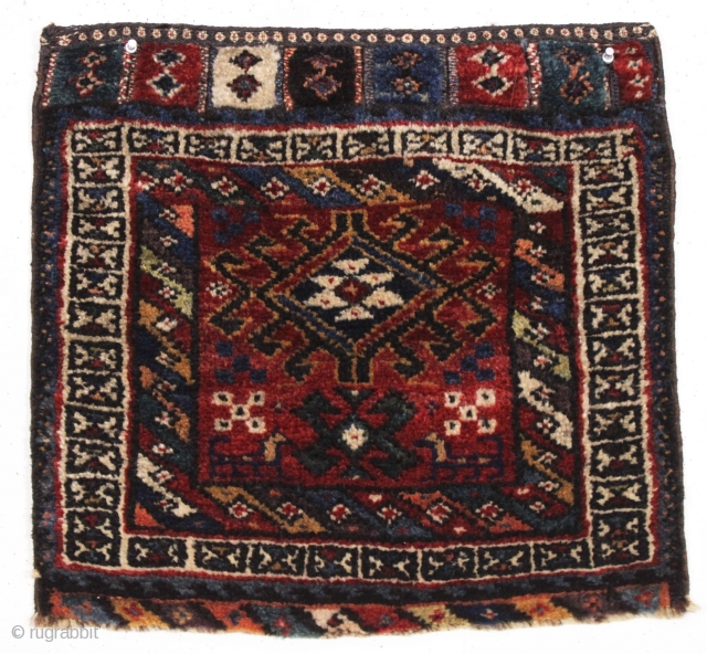 antique persian bagface, possibly baktiari. Charming little weaving featuring pile closure tabs. Full thick pile. All natural colors including a nice old purple. Reasonably clean. Good age, ca 1880. 20" x 21" 