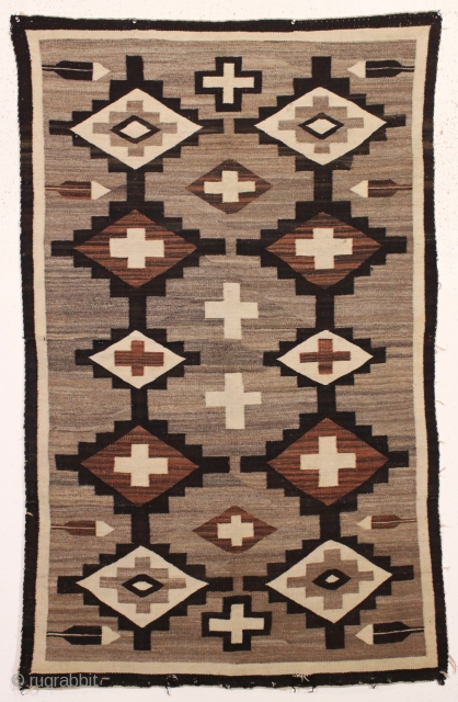 pretty little navajo rug with attractive feather design. local New England find. Good earthy natural colors with no dye run. Thin and floppy handle and clean. Reasonably good condition with one small  ...
