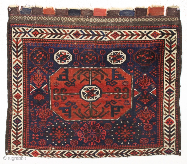 The first of a pair of antique baluch so called "octagon" bagfaces with an unusual design feature i have not seen before. The field motifs surrounding the center medallion change from top  ...