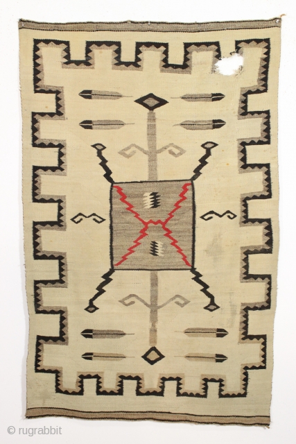 Older navajo rug with storm design. "as found", very dirty and with a good hole. Nice tight weave. No dye run. late 19th c. 3'6" x 5'7"      