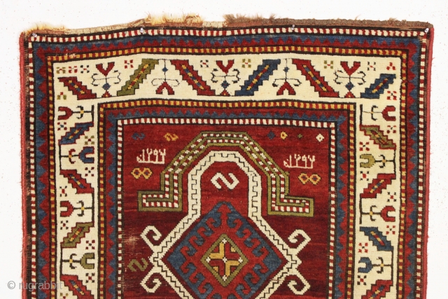 antique kazak prayer rug with inscribed date, 1292 (1875). Beautiful rug in pretty good condition with unusual and elegant drawing. All natural colors featuring an attractive abrashed mahogany red ground. "as found",  ...