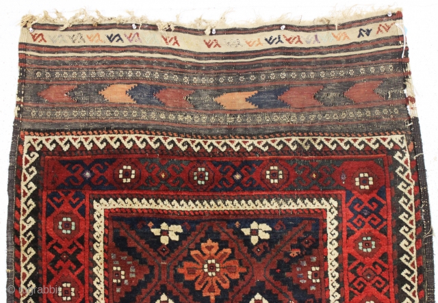 antique baluch rug with an interesting design and absurdly long kelim ends. Recent New England find. a very unusual combination of mina khani elements. As found, very dirty with mostly thick long  ...