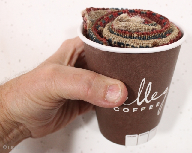 antique cup o' turkoman. No trick photography involved. This is a genuine coffee cup and a real hand. Inside is a folde and rolled very sweet small turkoman yomud mafrash. Excellent condition  ...