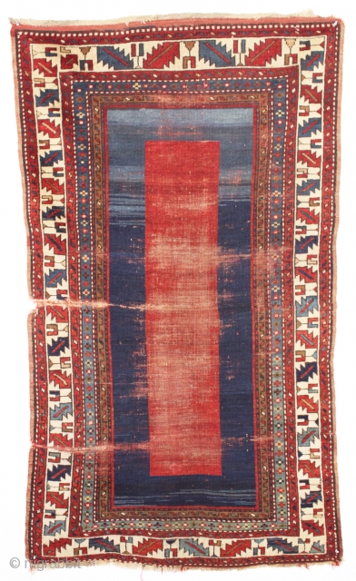 antique kazak rug with an entrancing minimalist field. Recent New England find, very dirty with overall wear, creases and slight end unraveling. Still, an object of some beauty. Good colors, good age.  ...