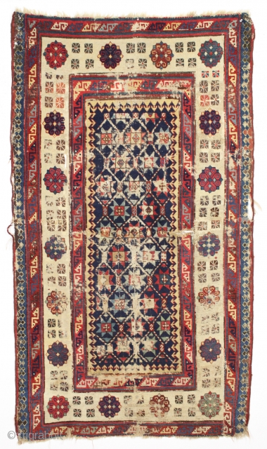 Early caucasain talish type rug with a few condition issues. Cut and shut across the center. Heavy wear, corrosion, tears, holes, and more. Not for everyone. Reasonably clean. Mid 19th c. or  ...