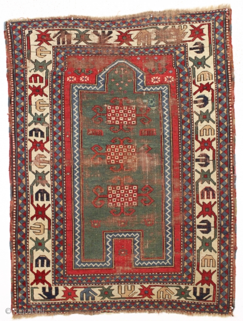 Early kazak prayer rug with true green field. Archaic field elements and bold eye catching ivory border. All good natural colors featuring a beautiful old green, a fine red, multiple blues and  ...