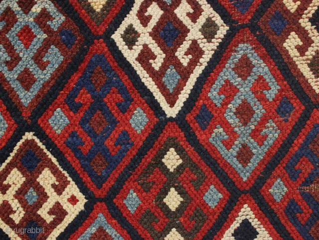 Antique tribal mystery rug. Charming little rug with a kurdish type diamond lattice design, complete with offset knotting in the field area. The overall color palette appears more veramin or luri to  ...