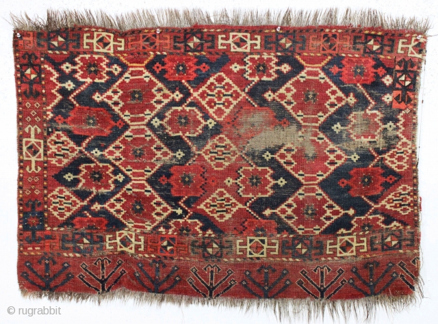 Antique ersari chuval. Large scale ikat inspired field design with a bold boreder and interesting elem panel. All natural colors. Bristly warps, probably goat hair. Creases, sewn tears, wear and assorted roughness  ...