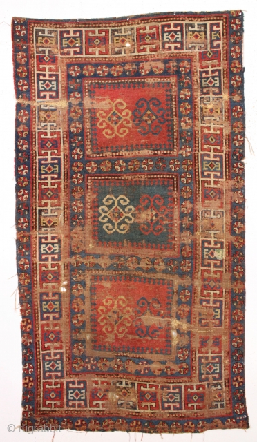 antique kazak. Unusual compartment design variant. In very abused condition with extensive wear, heavy oxidation and scattered damage as shown. A panolply (always wanted to use that word) of old repairs. Some  ...