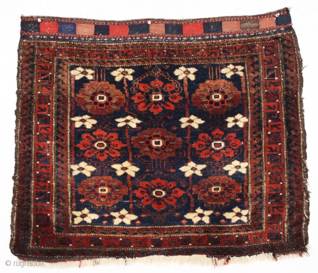 antique large baluch bagface with an older and very beautiful blue ground mina khani field. In full thick pile, nearly original, with no repairs. Appears to have an unusual single wefted structure.  ...