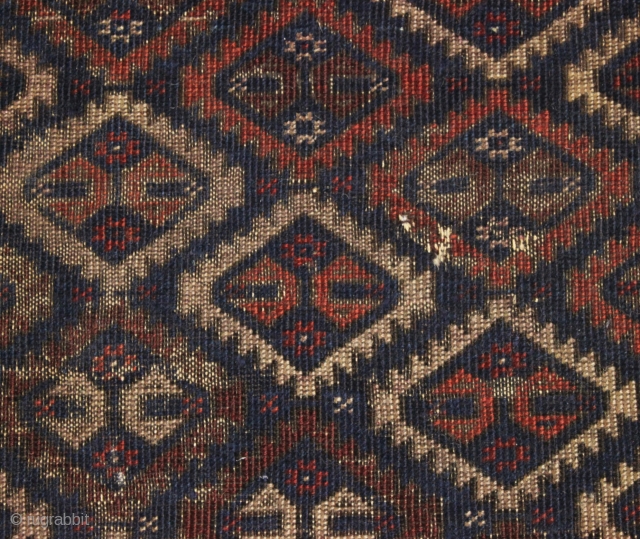 antique baluch rug with an unusual "c gul" design. As found, in very very very rough condition as shown. Heavily oxidized browns. Finely woven with remnant original selvages and kelim ends. Interesting  ...