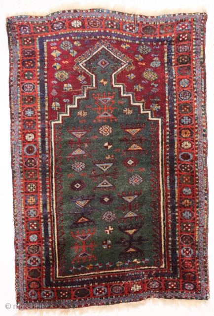 antique little east anatolian or yoruk prayer rug with a true green mihrab. Pile varies from good thick high pile to lower pile in center as shown. Few small creases. Good saturated  ...