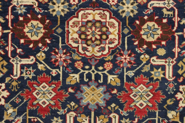 Antique large caucasian carpet fragment. Older afshan or blossum carpet type design with nice red kufic border. All vibrant natural colors. Mostly good even low pile. Small damaged area as shown, scattered  ...