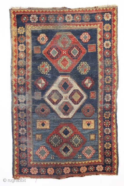 Antique kazak rug. Striking design and colors. "New England condition", in other words, very poor condition with very low pile, heavy wear and as dirty as they come. Who knows what will  ...