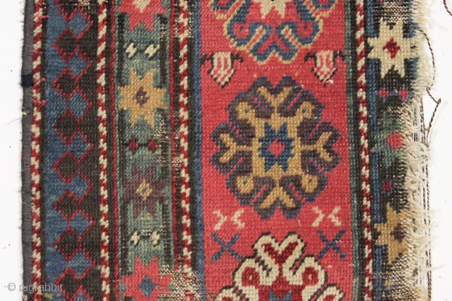 Small fragment of a caucasian rug. Superb natural colors. Seems like there is no end to these but I assure you there is. mid 19th c.  13" x 33"   