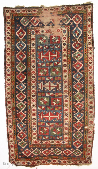 interesting older kazak rug with an unusual design and splendid colors. Eye catching main border. All natural colors featuring beautiful old greens. Appears to have a fair amount of natural dark wool  ...