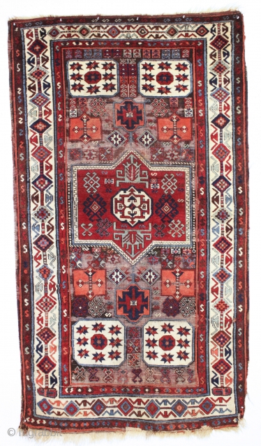 antique east anatolian kurdish long rug. Good older example of a classic type. In fair condition with much good thick pile combined with an almost completely corroded ground. All natural colors. Edges  ...