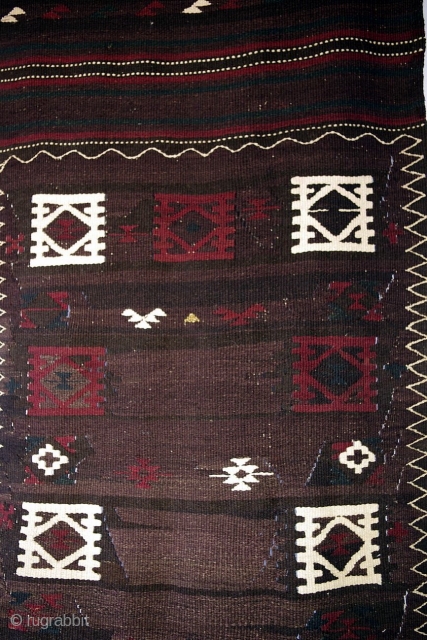 C143. Rare Muqori runner. The Muqori are a nomadic Pashtu-speaking group from southern Afghanistan. The field of this slit-weave kilim runner is a mixture of grey, brown and black wools that have  ...
