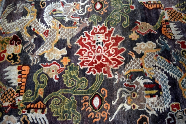 This is an exquisite vintage Tibetan rug which is approximately 50 years old. The rug was hand knotted on a traditional wooden loom using age-old techniques and 100% natural dyes. It was  ...