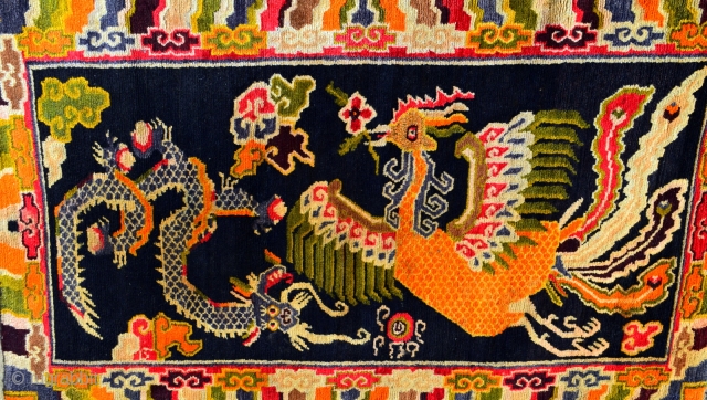 This is a semi-vintage, collectible Tibetan rug that is approximately 35 to 40 years years old. The rug was hand knotted on a traditional wooden loom using age-old techniques and 100% natural  ...
