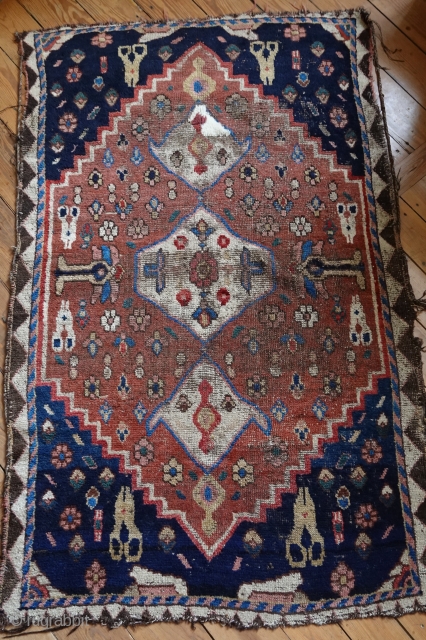South Persian Nomad rug, 180x113 cm, probably region Kohgilujeh, Ghaschghai or Luri-weavers.
Both the use of brown uncolored weft, shimmering through the pile, as the total absence of any chemical testify great age.  ...