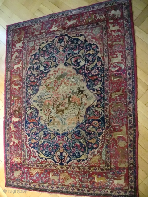 Persian Dragon rug, 187/145 cm.,19thC.Attributable either to Kirman(Kerman) because of the deep'Bordeaux'red, or to Isfahan because of the dragon and animal phantasies. This thin and exquisite rug has survived well due to  ...