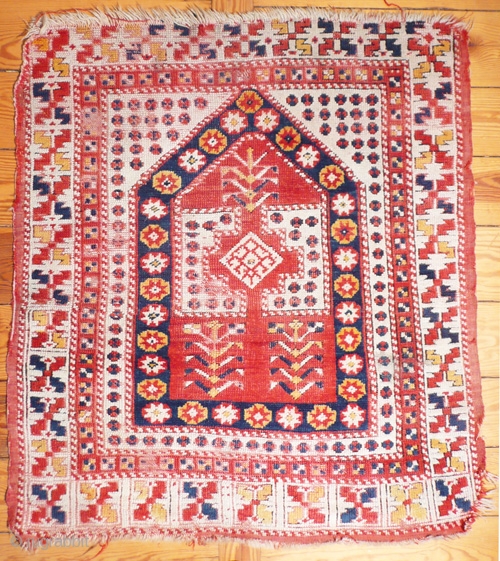 Turkish prayer rug. Ezine/Cannakale region. 120x90 cm. w/w.19th.c. Don't get this rug wrong because its price is so moderate.Very representative for this region, with good colors&pile.They don't go much better than this  ...