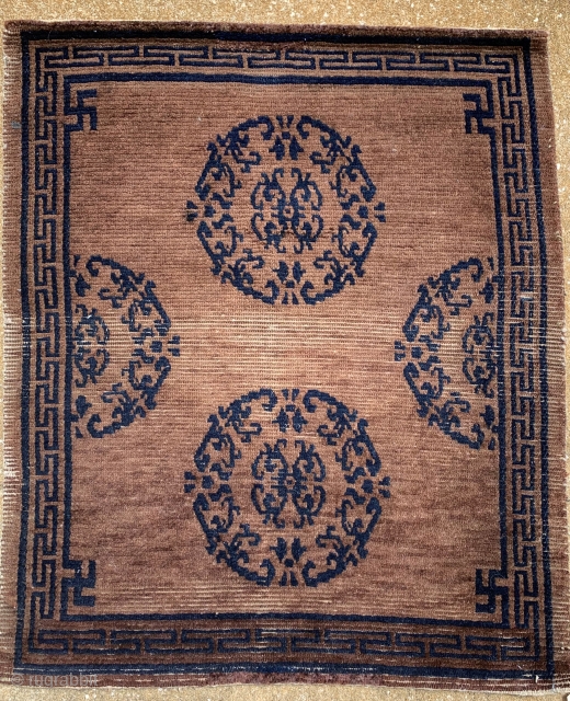 Small Tibetan Piece 29 x 25 inches. Nice natural brown and indigo blue with well defined medallions. Some wear trough center which may indicate a top saddle rug use.  The design  ...