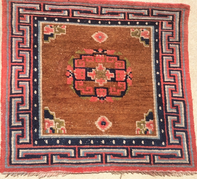 Nice Tibetan Sitting Rug.  No color run and believe colors are all good.  Size 33 x 29 inches.  All wool construction.         