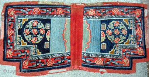 Tibetan Lower Saddle Rug; 51”x24” Chinese silk brocade medallion design. Overall condition good with wear on felt border.               