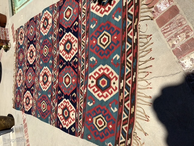 Here is an unusually sized kilim 6’8” x 12’7” it’s one piece not two and I very good condition. Note a few small nips in border. Has good age and ...