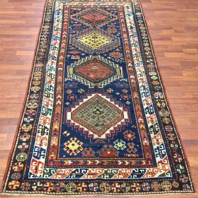 # 2294-  Antique Kazak Caucasian rug with the size 3 ft. 8 inches by 7 ft. 9 inches, excellent condition with slight oxidized browns.        