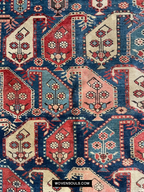 Lovely old gendge rug. The most enjoyable elements are the figures - the two men (yes very clearly men) and their animals. More details here: https://wovensouls.com/collections/antique-persian-rug-carpet/products/1645-antique-gendge-boteh-rug-with-figures       