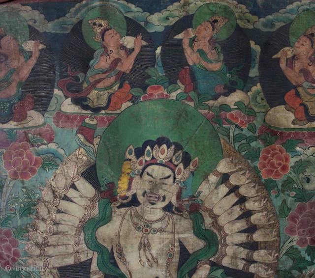 A very unusual Nepalese or perhaps East Tibetan 19th century Buddhist thangka of Maha Cundi with eighteen arms seated on a green dragon and holding a basket of jewels with four aspara  ...