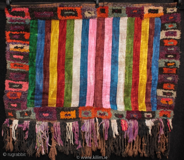 Mystery weaving of unknown use and origin.

Thick wool pile on a coarse striped flatweave foundation woven with natural dark and mid brown sheep wool in two panels on a narrow hand loom.  ...