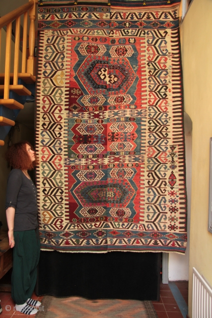 Antique Anatolian Konya region Hotamis dowry kilim with a complex border design also found in Aydin Cine kilims. The kilim shows interesting variations in style, drawing and intention in the weaving of  ...